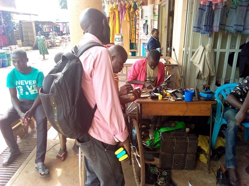 Customers waiting for their appliances They do repair in the presence of their customers